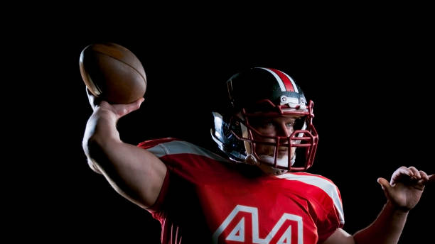 istock American football player holding a ball 846310538