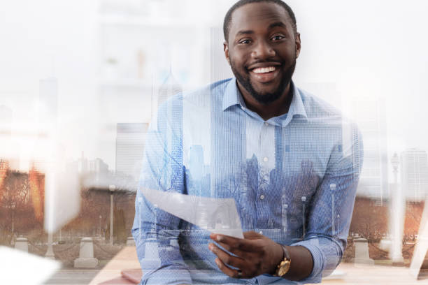 istock Excited African American holding a document in his hand 846310714