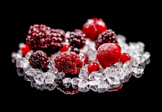 Frozen in ice cubes fruits and berries