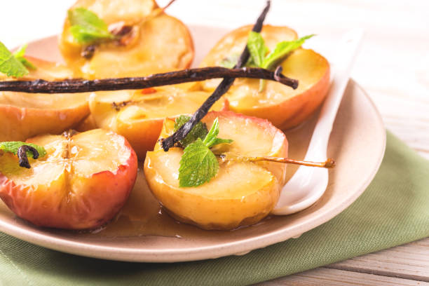 istock Baked red apples with vanilla syrop, mint and honey 846324248