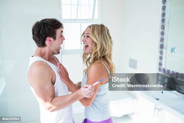 Happy Couple Being Excited With Positive Pregnancy Test Stock Photo - Download Image Now