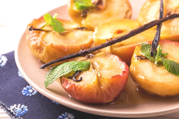 istock Baked red apples with vanilla syrop, mint and honey 846329716