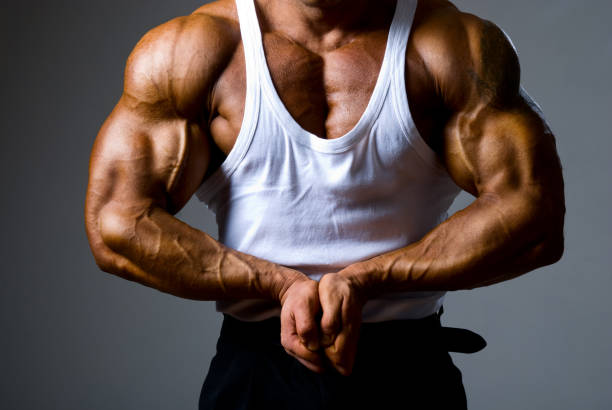 istock Close up of a handsome man trained bodybuilder standing in a pos 846329948
