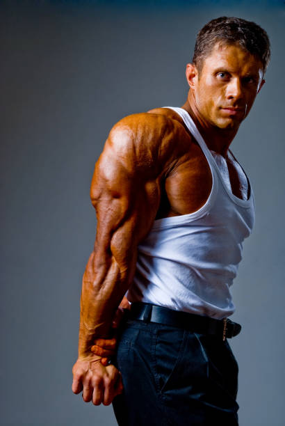 istock A young and fit male model posing his muscles 846329982