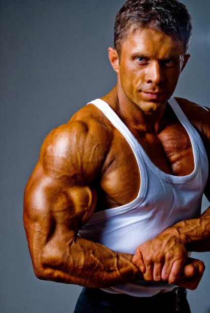 istock A man shows his muscles in the studio 846330066