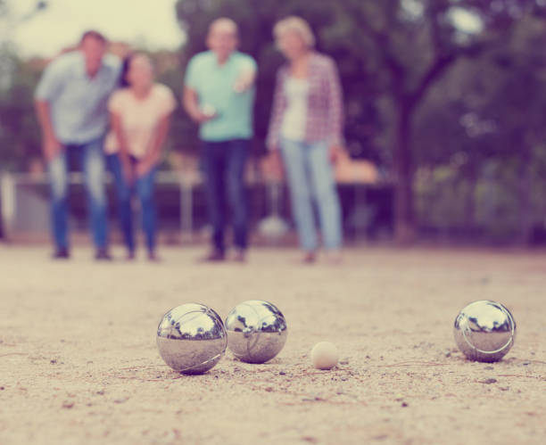 istock friendly mature couples playing petanque at leisure 846330676