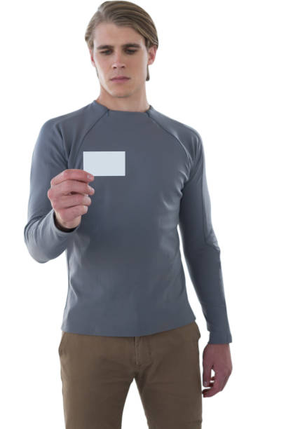 istock Businessman reading card against white background 846333538