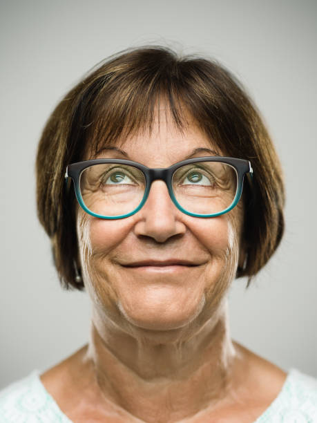 istock Real senior woman portrait looking up 846333556