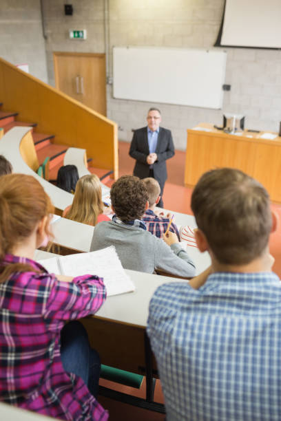istock Teacher with students at the lecture hall 846333792