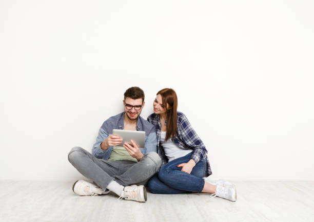 istock Casual couple working with tablet, studio shot 846337750