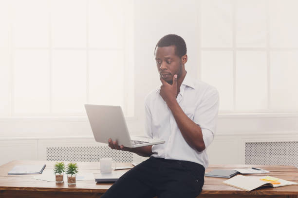 istock Thoughtful black businessman in casual office, work with laptop 846339084