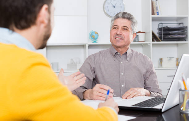 istock Men sign credit agreement 846343594