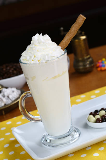 hot white chocolate mocha, decorated with whipped cream - latté hot chocolate hot drink indulgence imagens e fotografias de stock