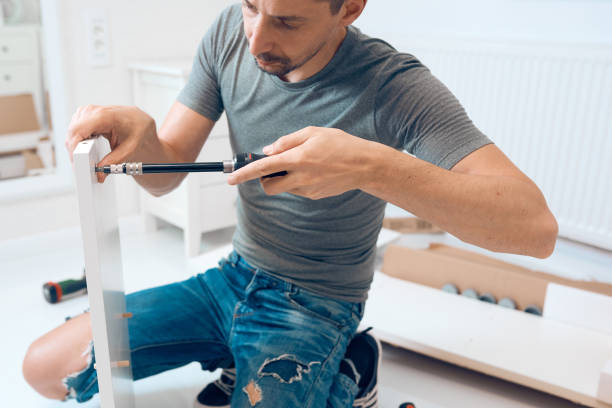 istock craftman assembleing furniture 846347610