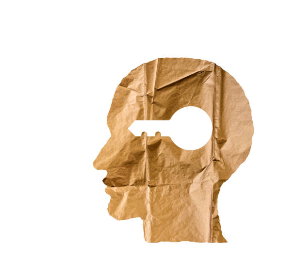 istock Crumpled paper shaped as a human head and key on white background. Safety and secrets concept. 846347712