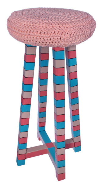 istock Handmade stool in pink, red, blue stripes. Round seat with pink woolen material. 846351140