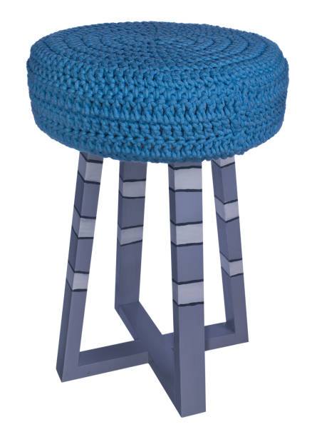 istock Handmade stool in gray, white, black patterns. Round seat with blue woolen material. 846351142