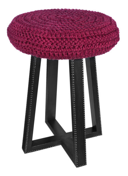 Handmade stool in black with white dots. Round seat with red woolen material.
