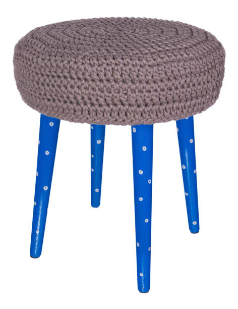 istock Handmade stool blue in white patterns. Round seat in grey woolen material. 846351200
