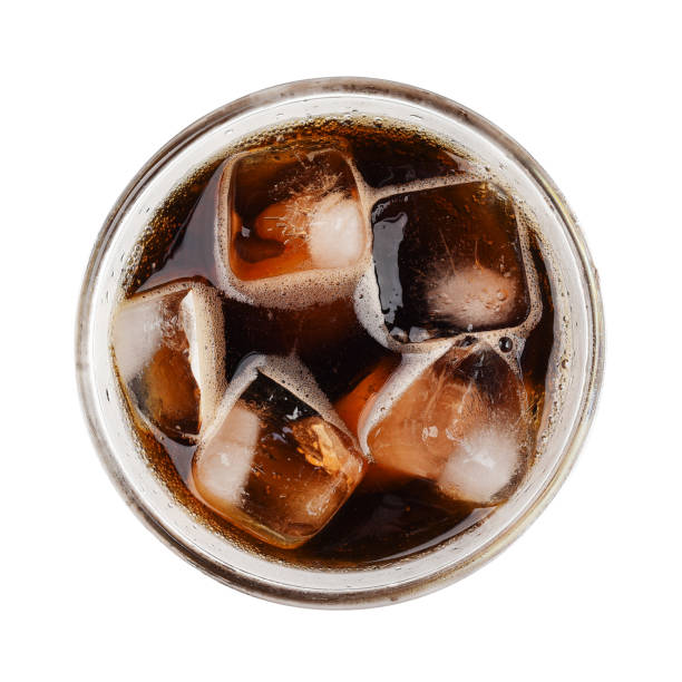 istock Cola soda with ice on glass isolated on white background top view 846354496