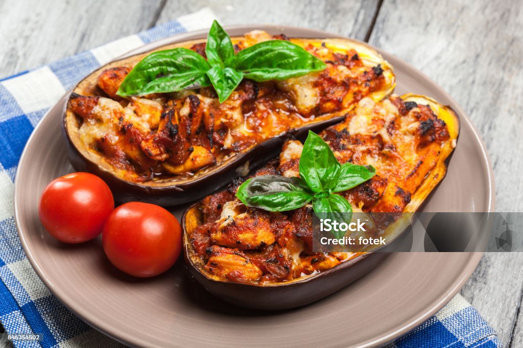 Baked eggplant with pieces of chicken Baked eggplant with pieces of chicken in tomato sauce Eggplant Stock Photo