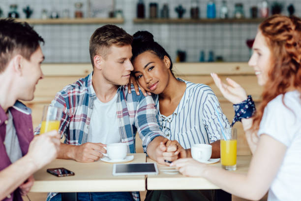 istock multiethnic couple with friends in cafe 846354670