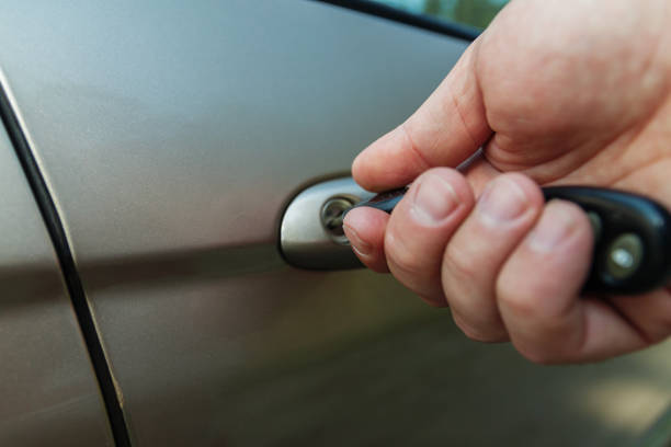 istock man's hand opens the car door with a key 846358606