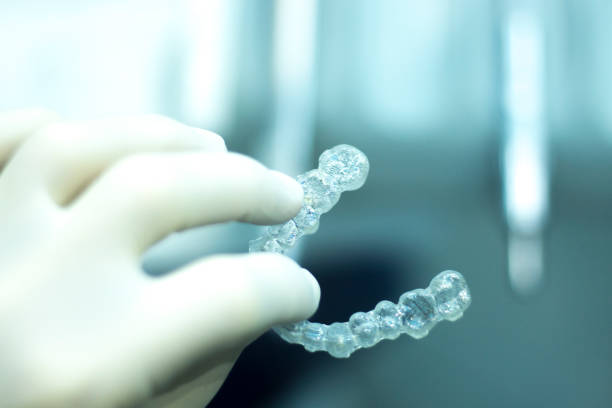 istock Invisible teeth retainers orthodontic brackets. Plastic modern straighterners to correct tooth alignment. 846359452