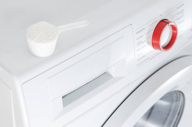 istock washing powder over washing machine 846362082