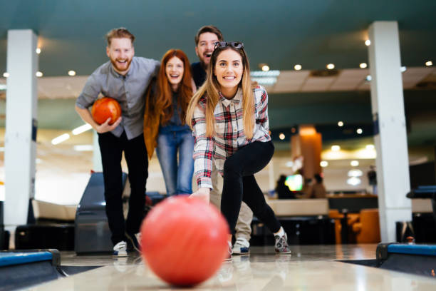 istock Friends having fun while bowling and speding time together 846362646
