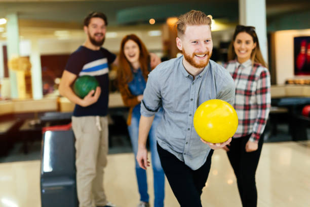 istock Friends bowling at club and having fun playing casually 846362654