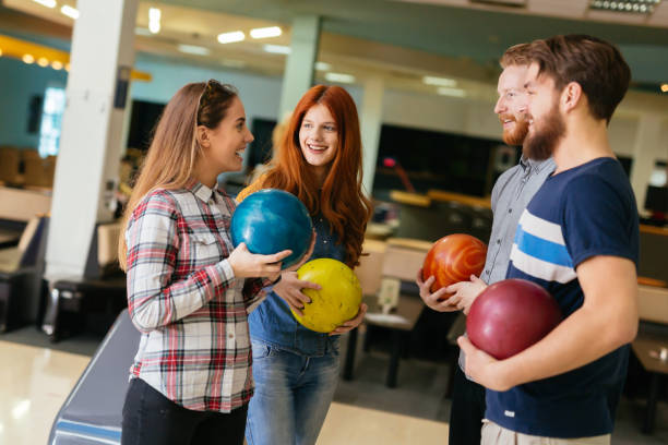 istock Friends having fun while bowling and speding time together 846362684