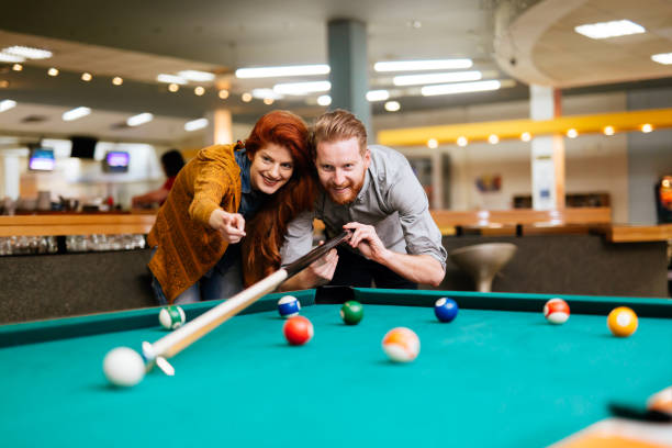 istock Beautiful couple dating and playing snooker 846362792