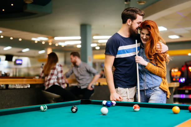 istock Beautiful couple dating and playing snooker 846362814