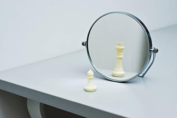istock White chess pawn imagining itself as a king 846365862