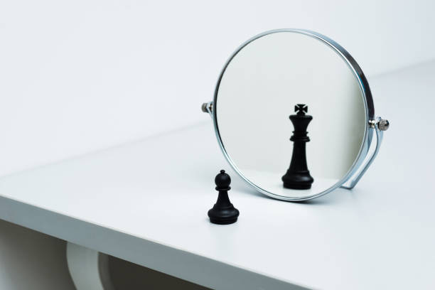 istock Black chess pawn imagining itself as a king 846365966