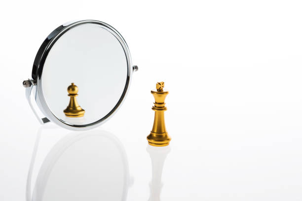istock Golden chess king imagining itself as a pawn 846366302