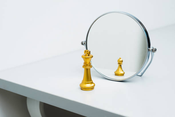 istock Golden chess king imagining itself as a pawn 846366658