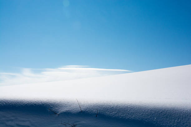 istock Pure white snowy field and blue sky 846369916