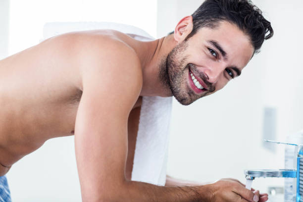 istock Man washing his face in sink 846370322