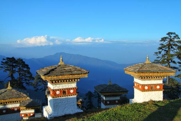 The 108 chortens (stupas) is the memorial in honour of the Bhutanese soldiers with layer of mountains at  Dochula Pass on the road from Thimphu to Punaka, Bhutan stock photo