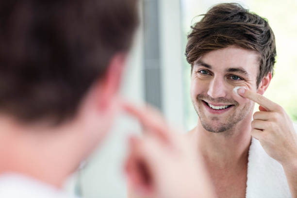 istock Smiling handsome man applying cream 846370756