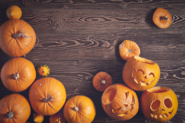 istock Halloween pumpkins over wooden background 846374060