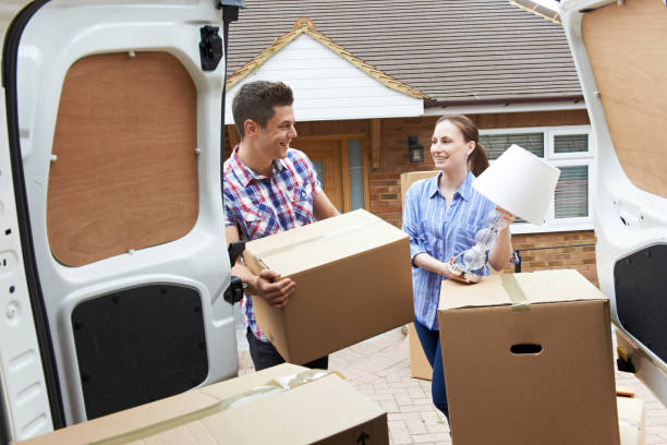 istock Young Couple Moving In To New Home  Unloading Removal Van 846374178