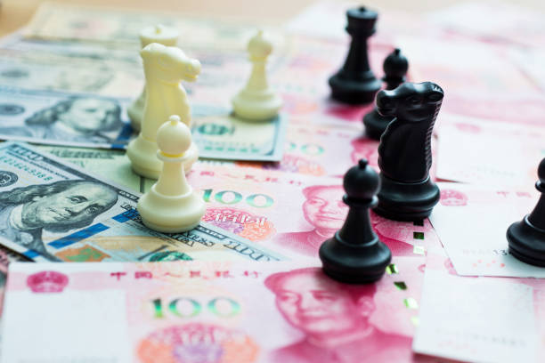 istock Chess pieces standing on dollar and China yuan 846374246