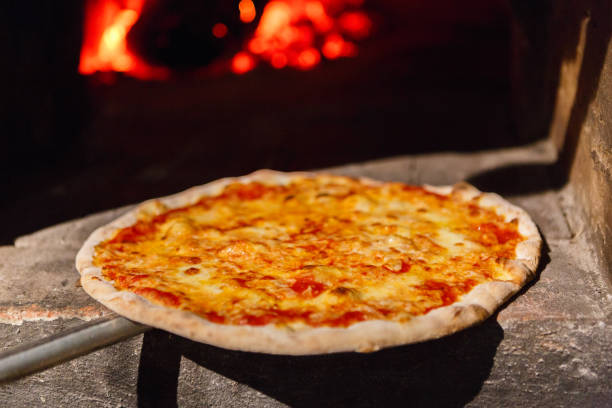 istock Fresh baked pizza with cheese near oven 846377650