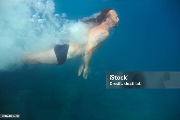 Man Swimming Underwater Stock Photo - Download Image Now - Active Lifestyle, Activity, Adult