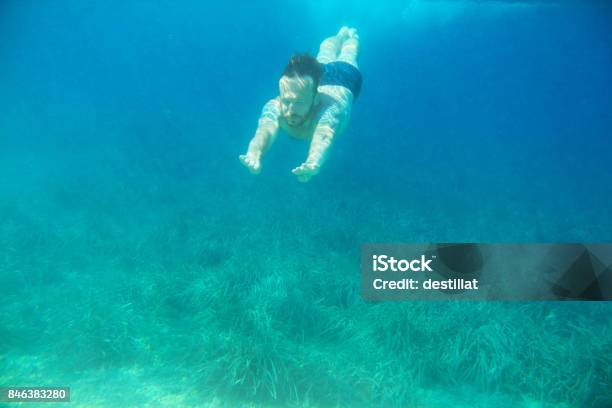 Man Swimming Underwater Stock Photo - Download Image Now - Active Lifestyle, Activity, Adult
