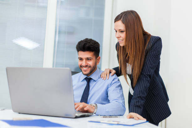 istock Two business people working with a laptop 846394366