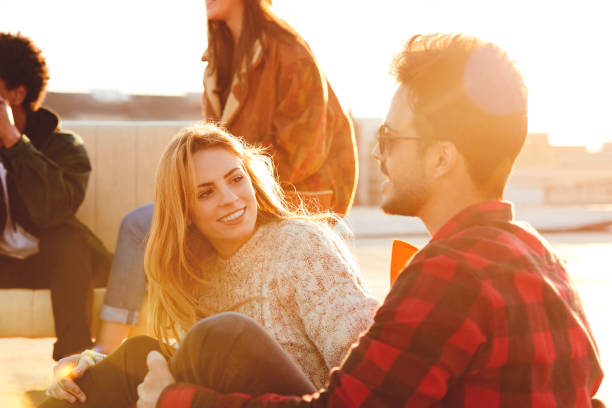 istock Friends resting at rooftop on sunny day 846394380